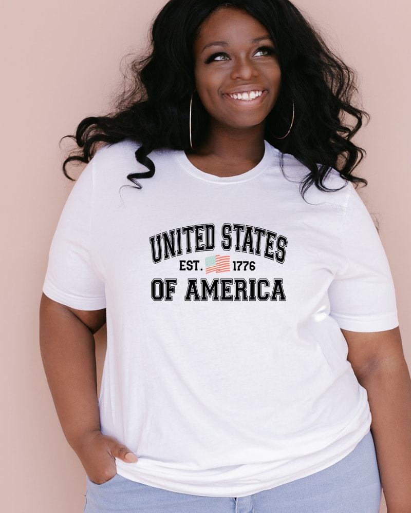 Front of a model wearing a size XL USA est 1776 in White by Simply Sage Market. | dia_product_style_image_id:281600